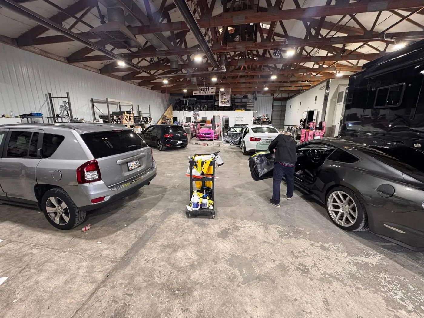 Car under shop lights after a window tint install